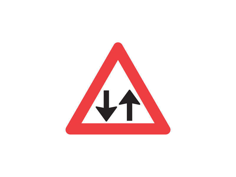 A18 - Modkørende færdsel. Tavlen kan opstilles efter en strækning med ensrettet færdsel, efter motorvej, vær her særlig opmærksom på vejens forløb.